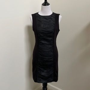 Black knit dress with faux leather insert.